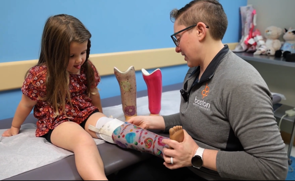 Lauren fitting Emery with Prosthesis