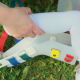 Child's leg in a sock being placed into a femur fracture brace